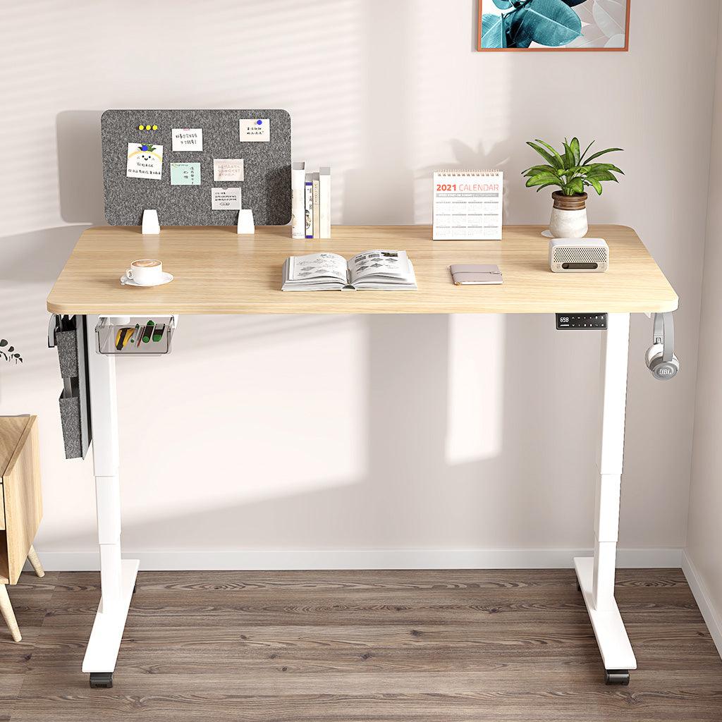 Oak standing desk white frame with drawer, cable management hook and castors in the living room